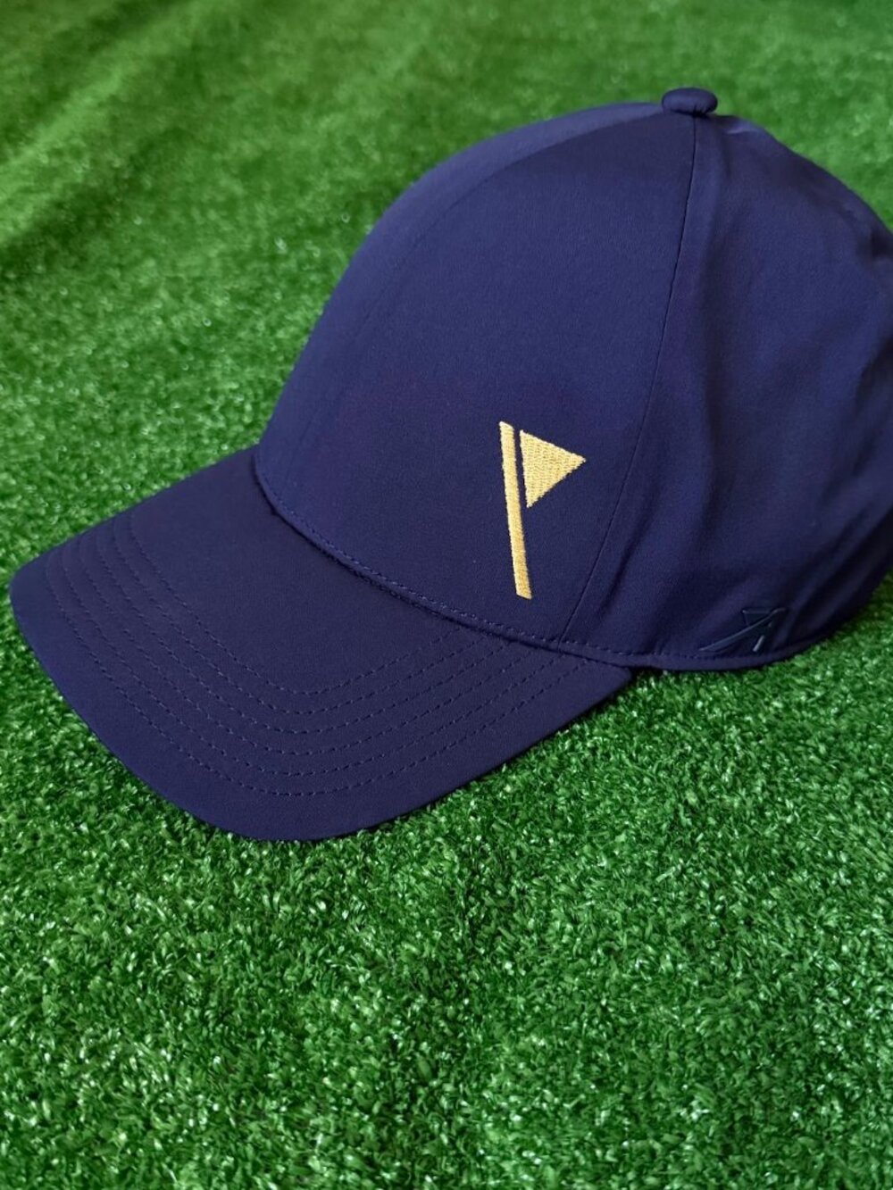Isleworth Golf Club Ahead Performance Navy Blue Hat Gold Logo OSFM Stretch Cap